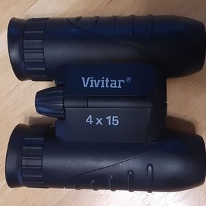 Vivitar binoculars 4 x 15 with original case, strap and box.